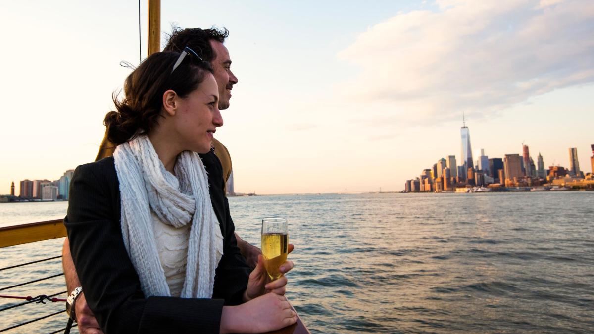 Couple drinking wine and enjoying view of NYC